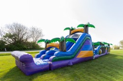 18ft tall tropical slide attached to 38ft long tropical obstacle