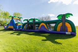 tropical20oasis 1777571290 18ft tall tropical slide attached to 38ft long tropical obstacle