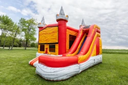 fiery fortress bounce house slide side 1778249155 The Fiery Fortress Dry Bounce House with slide