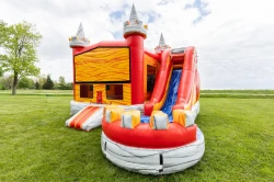 fiery fortress waterslide side 1778249573 The Fiery Fortress Wet Bounce house with slide