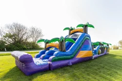 18ft tall tropical slide attached to 38ft long tropical obstacle