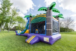 tropical bounce house double slide side 1778274088 Tropical Wave Wet bounce house with double slide