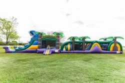 79ft long Tropical Oasis obstacle and bounce house with double slide
